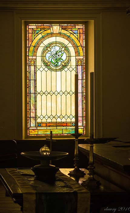 church stained glass window by altar