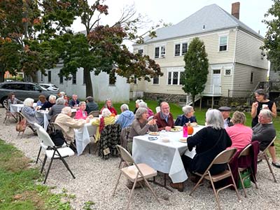 parish picnic outdoors in late summer