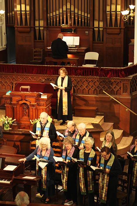 rev janet with choir during a service