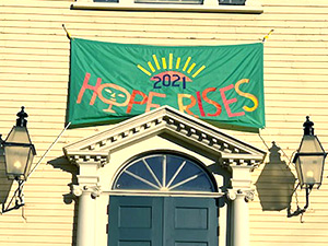 banner above door saying hope rises