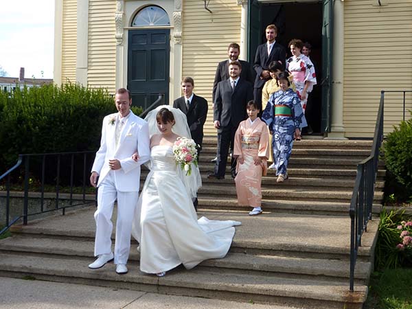 bridal party leaving the church after the ceremony