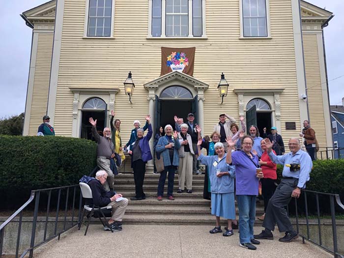 people waving after the service